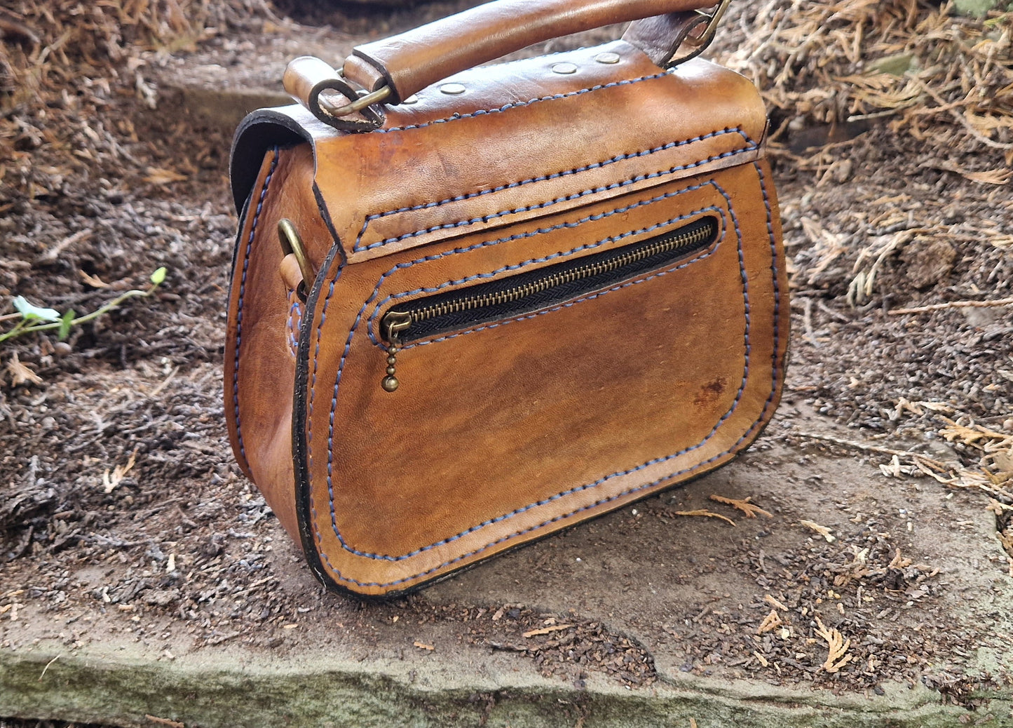 Saddlebag with leather inlay