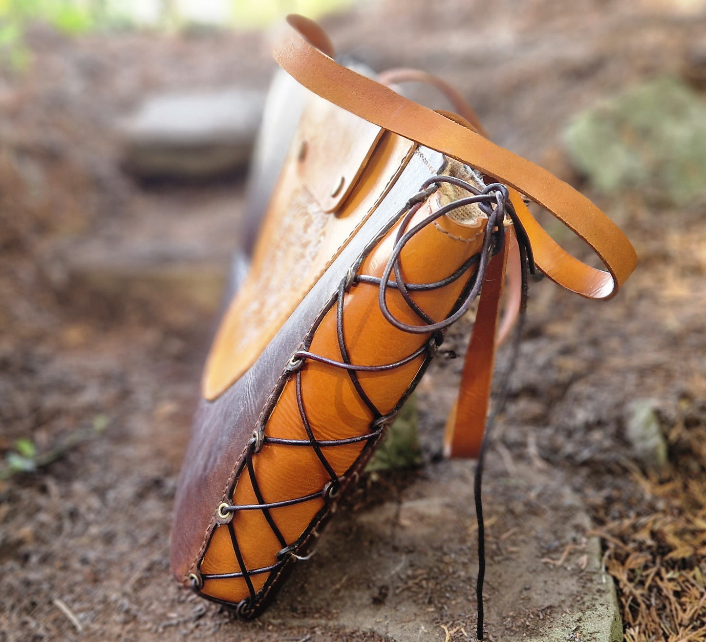 Tote, hand-tooled and strapped