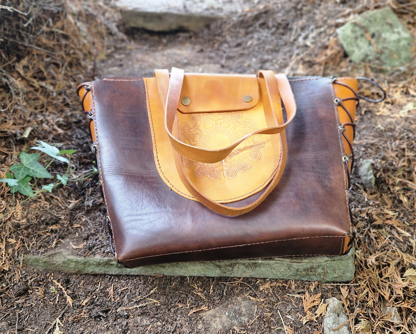 Tote, hand-tooled and strapped
