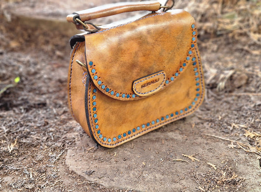Saddlebag with leather inlay