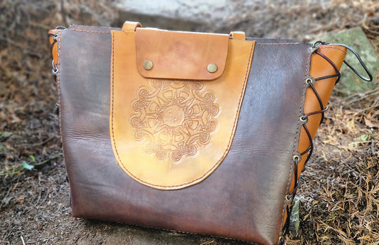 Tote, hand-tooled and strapped